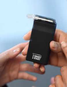 a person holding a black box