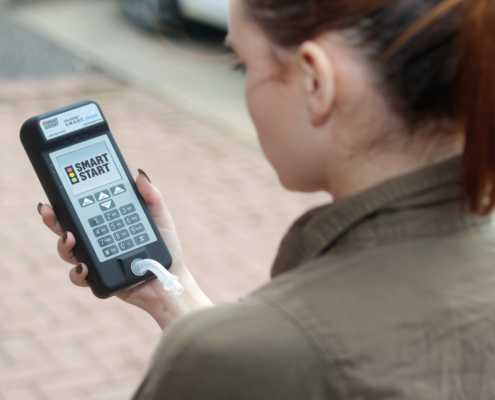 Photo of Girl Holding SmartMobile Device Outside